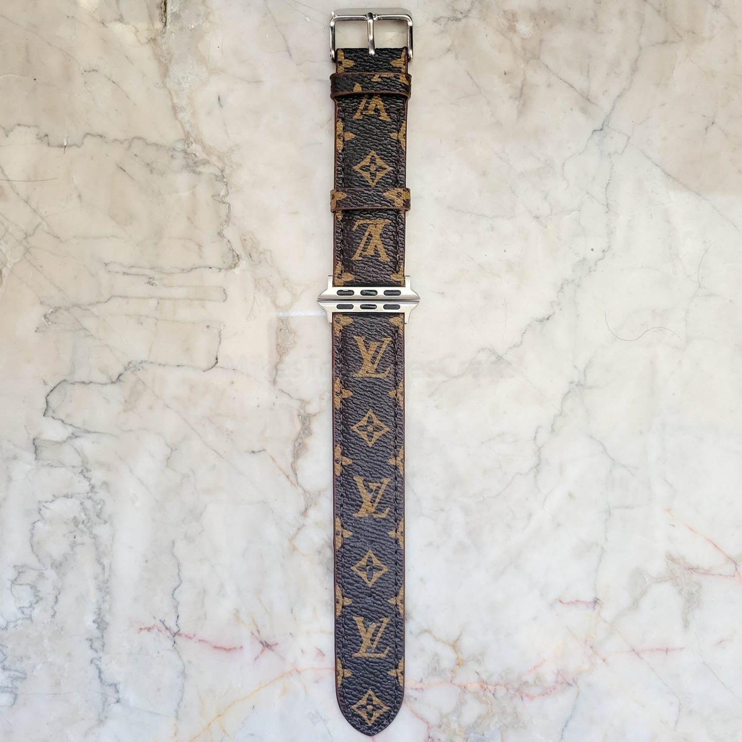 Elegant Brown Apple Watch LV Band with Small, Chic Print