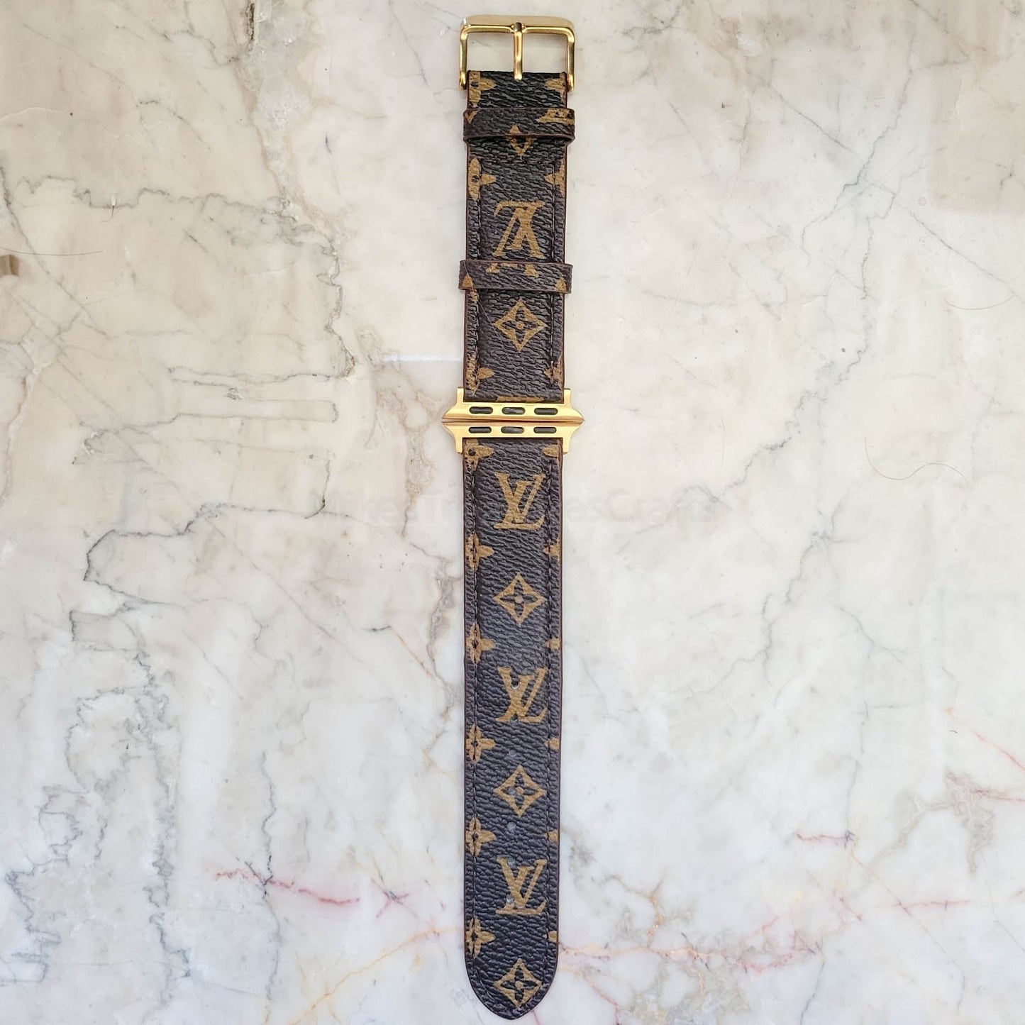 Elegant Brown Apple Watch LV Band with Small, Chic Print