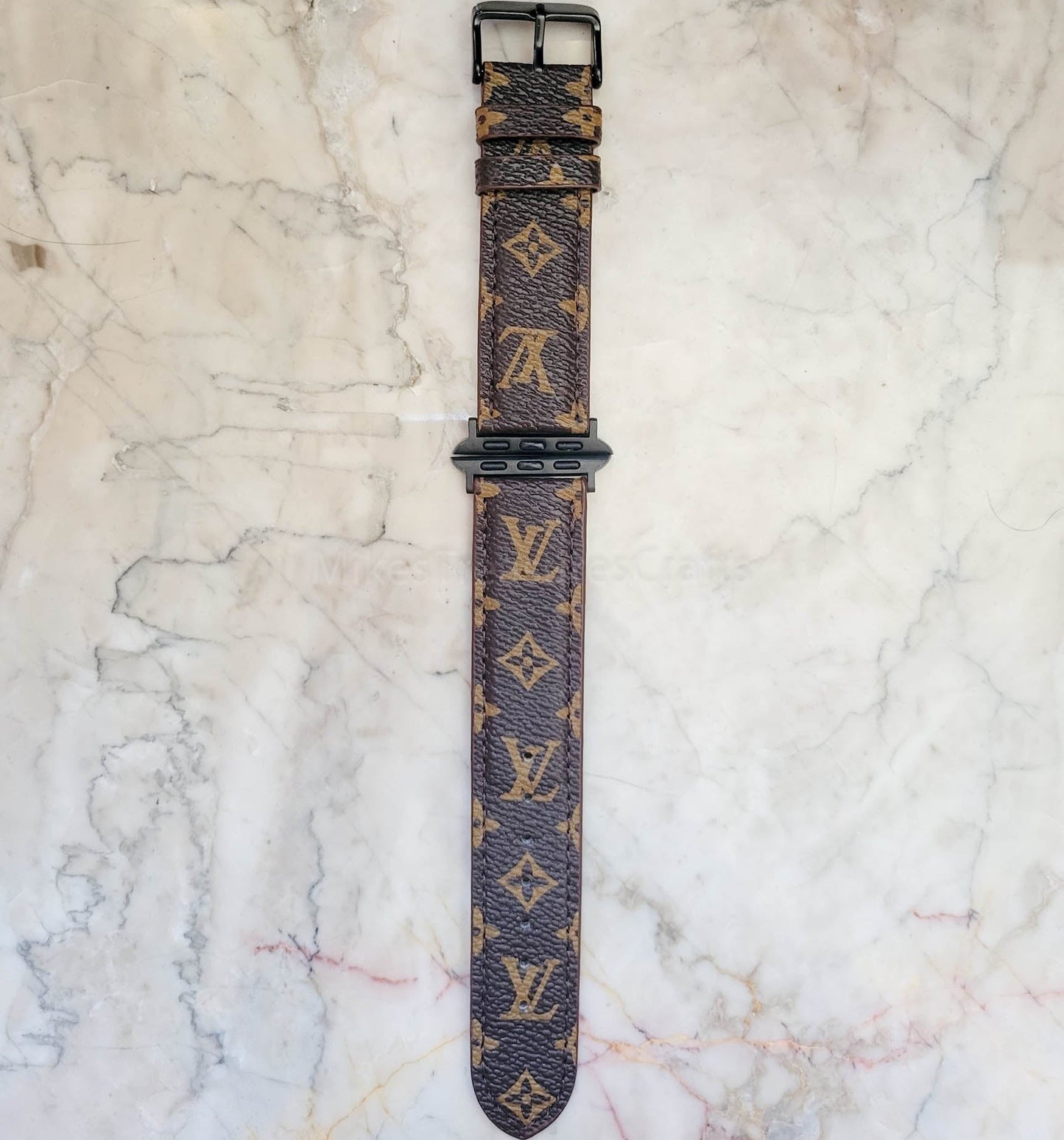 Elegant Brown Apple Watch LV Band with Small, Chic Print