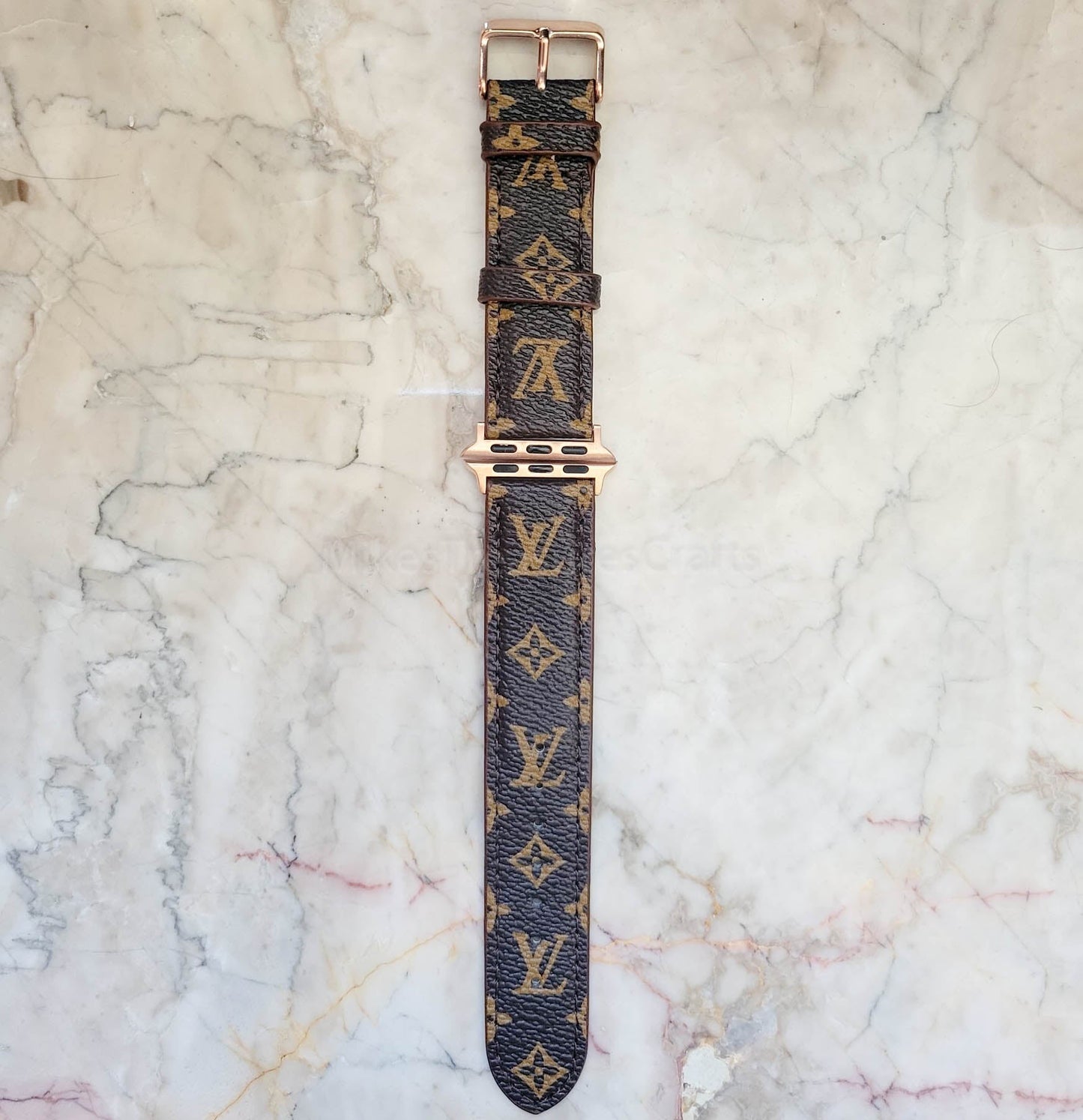 Elegant Brown Apple Watch LV Band with Small, Chic Print